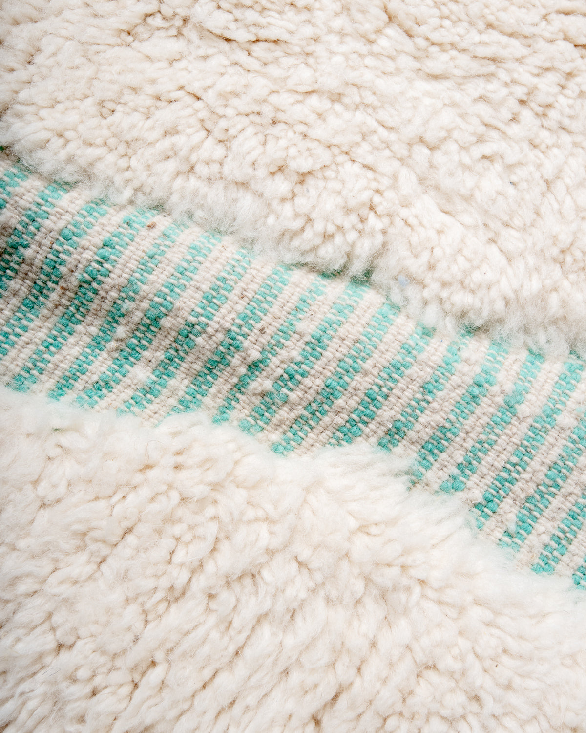 Modern, designer, handcrafted Berber rug from Morocco. Beniourain carpet with beautiful colours and patterns and fluffy wool texture.